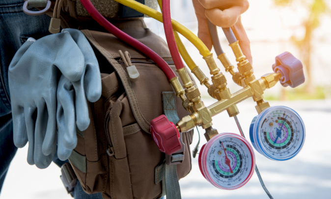 Worker holding tools